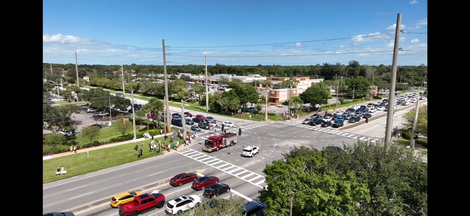 Aerial field observation of traffic and a fire rescue vehicle at Route 60 and 58th Avenue